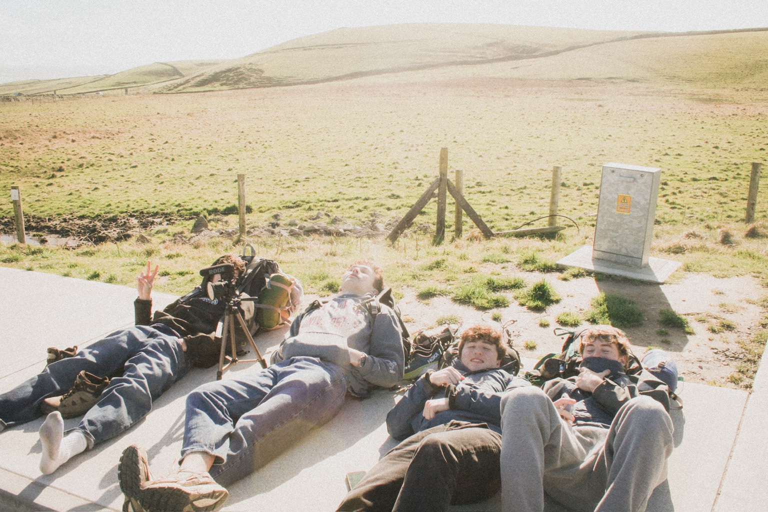 Friends resting together on a bright day during a road trip