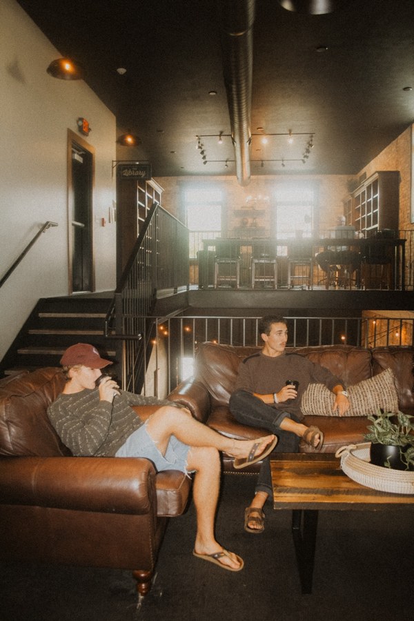 Warm indoor lounge scene with friends