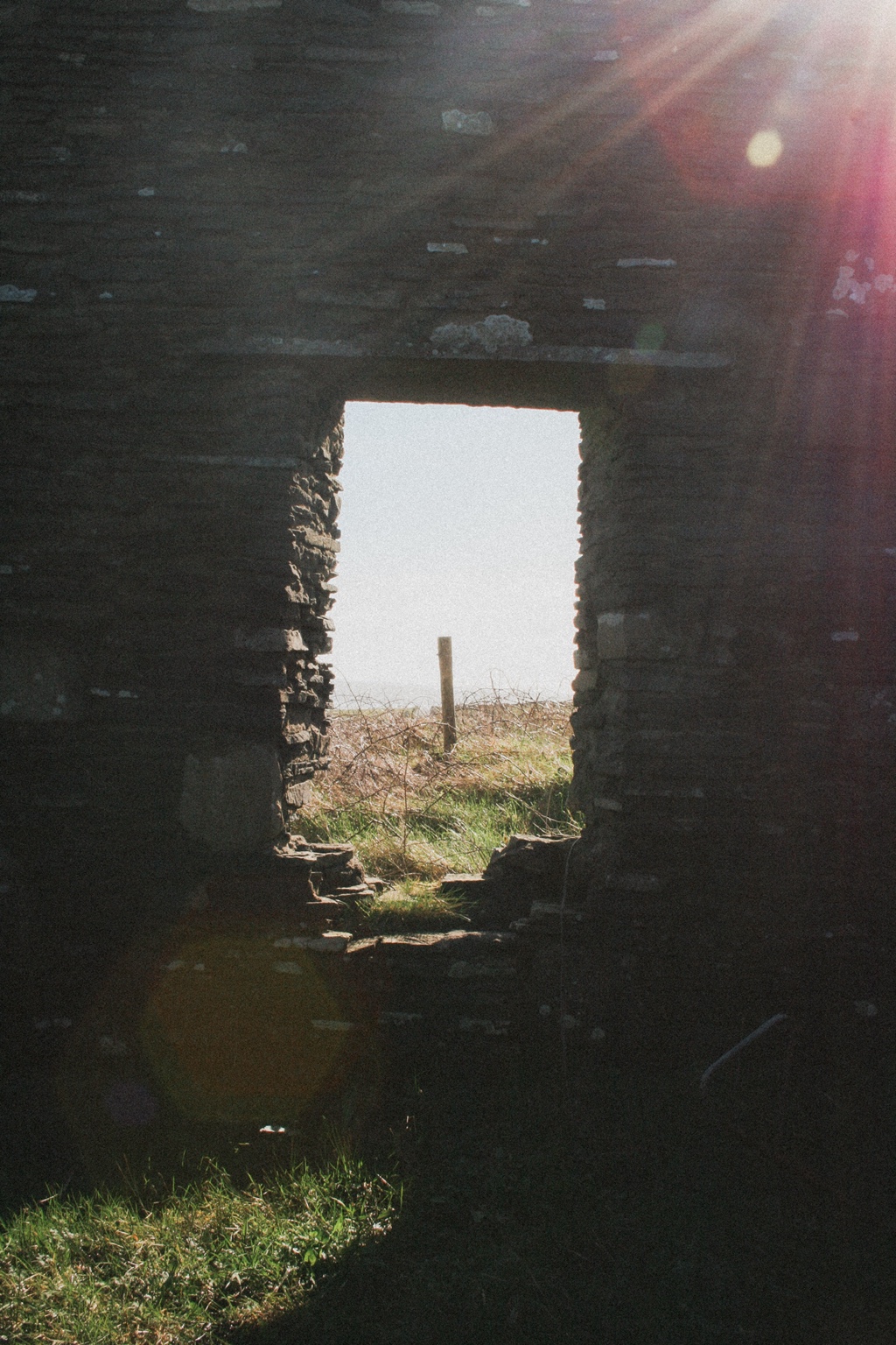 Sunlight through a stone ruin doorway